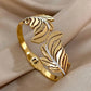 Featherelle – Elegant Gold-Plated Feather & Rhinestone Cuff Bracelet